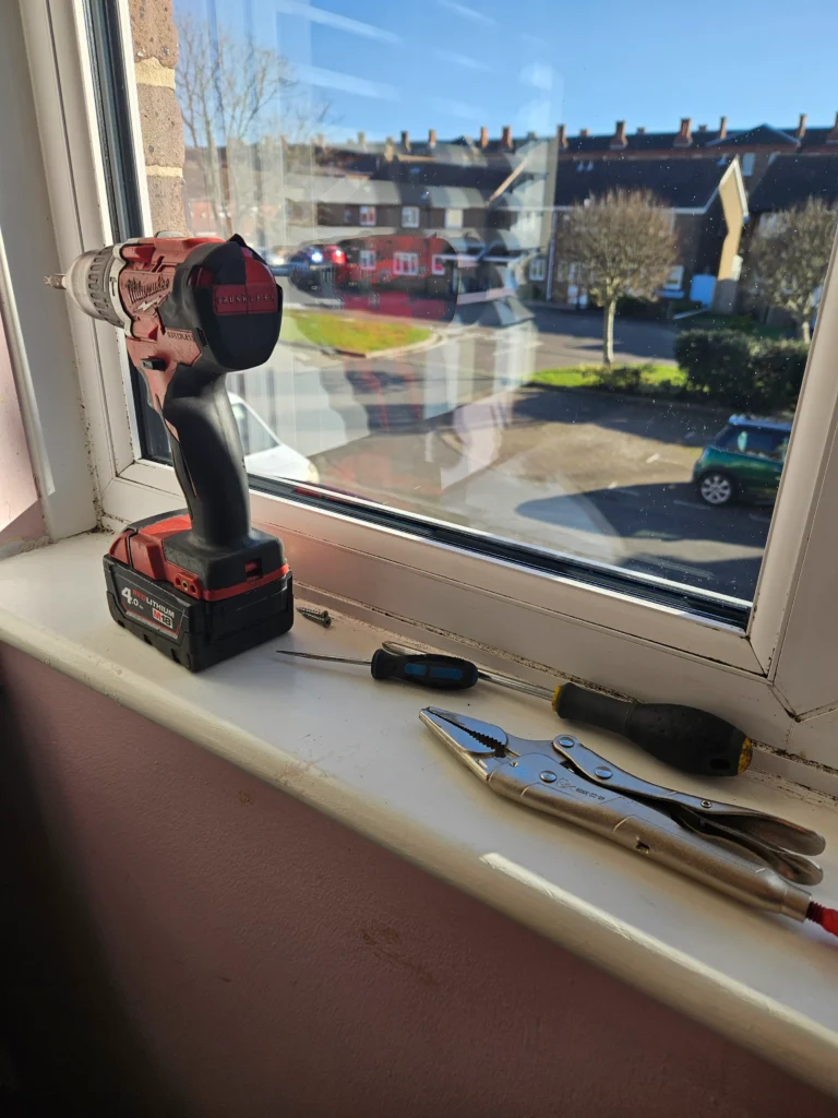 Window repairing tools near the window