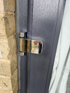Newly fitted hinge on a front door of a property in Portsmouth
