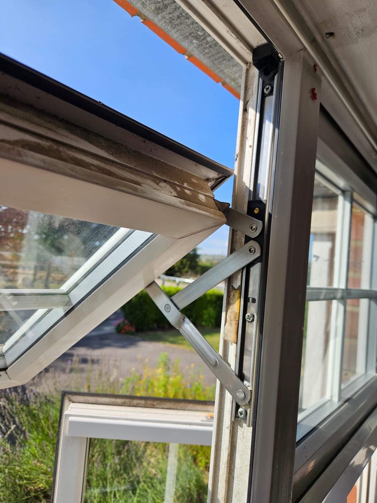 Repair work on a hinge of a window for a household in Portsmouth