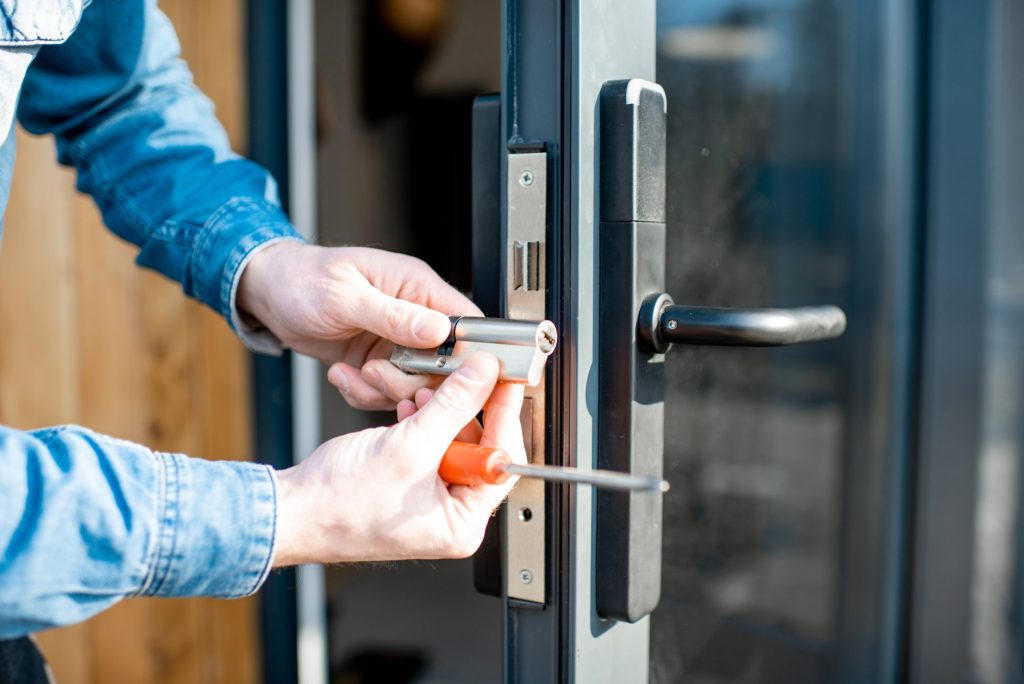 Locksmith changing the lock of a new house
